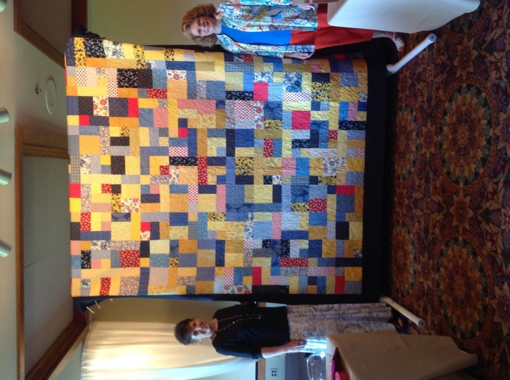 Raffle quilt with Piecemakers members Terry Sheldon and Elaine Slate