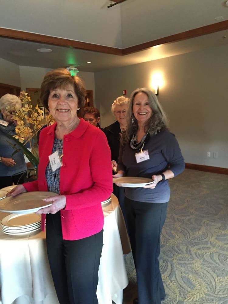 Jeanne Wood and Barbara Young share a smile in the buffet line.